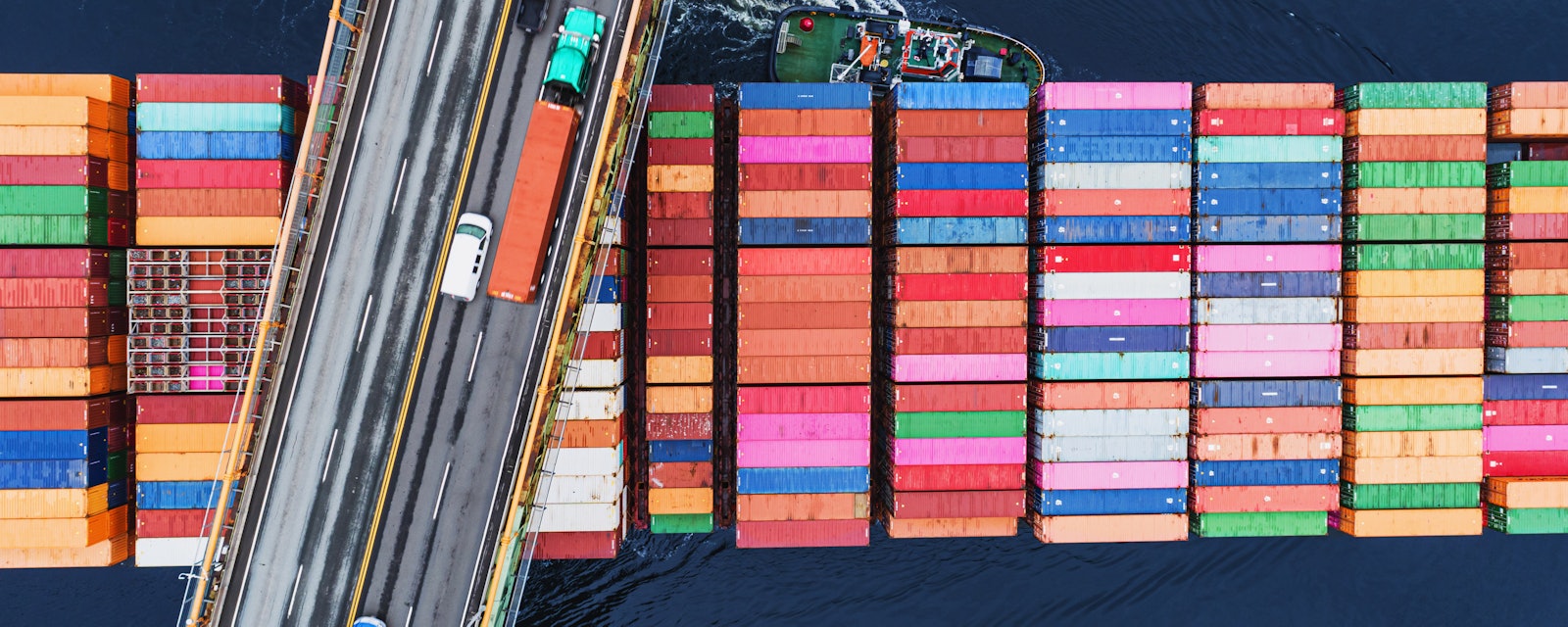 Container ship passing bridge