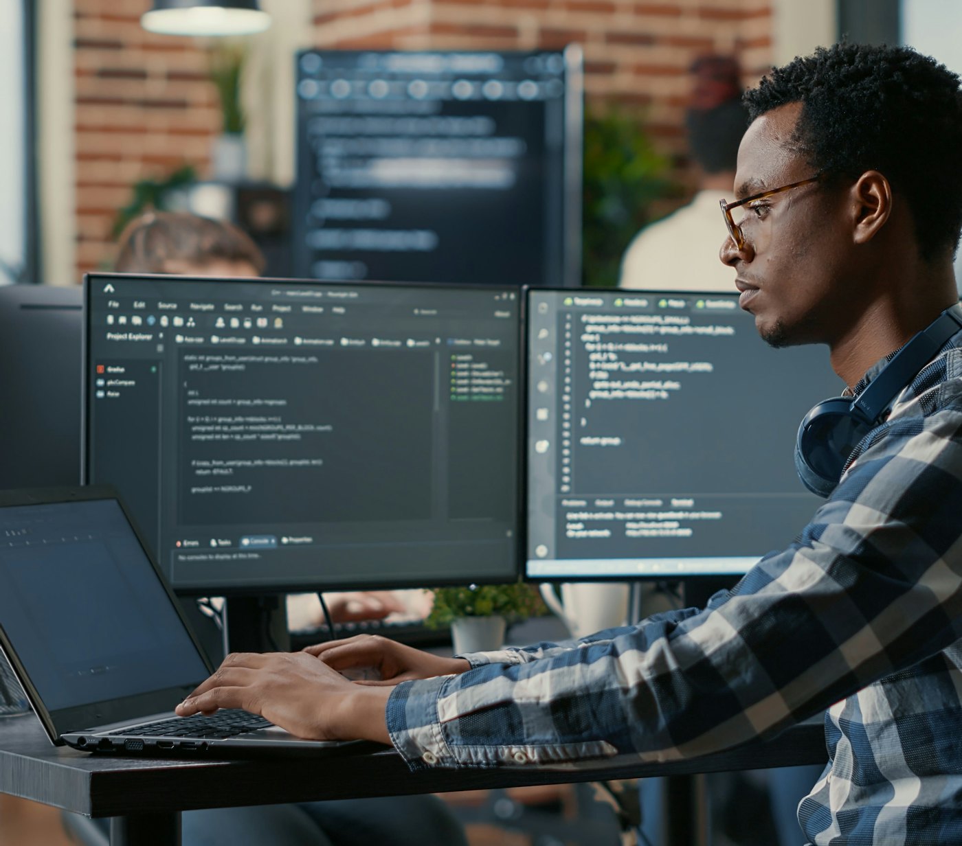 Man sitting behind laptop