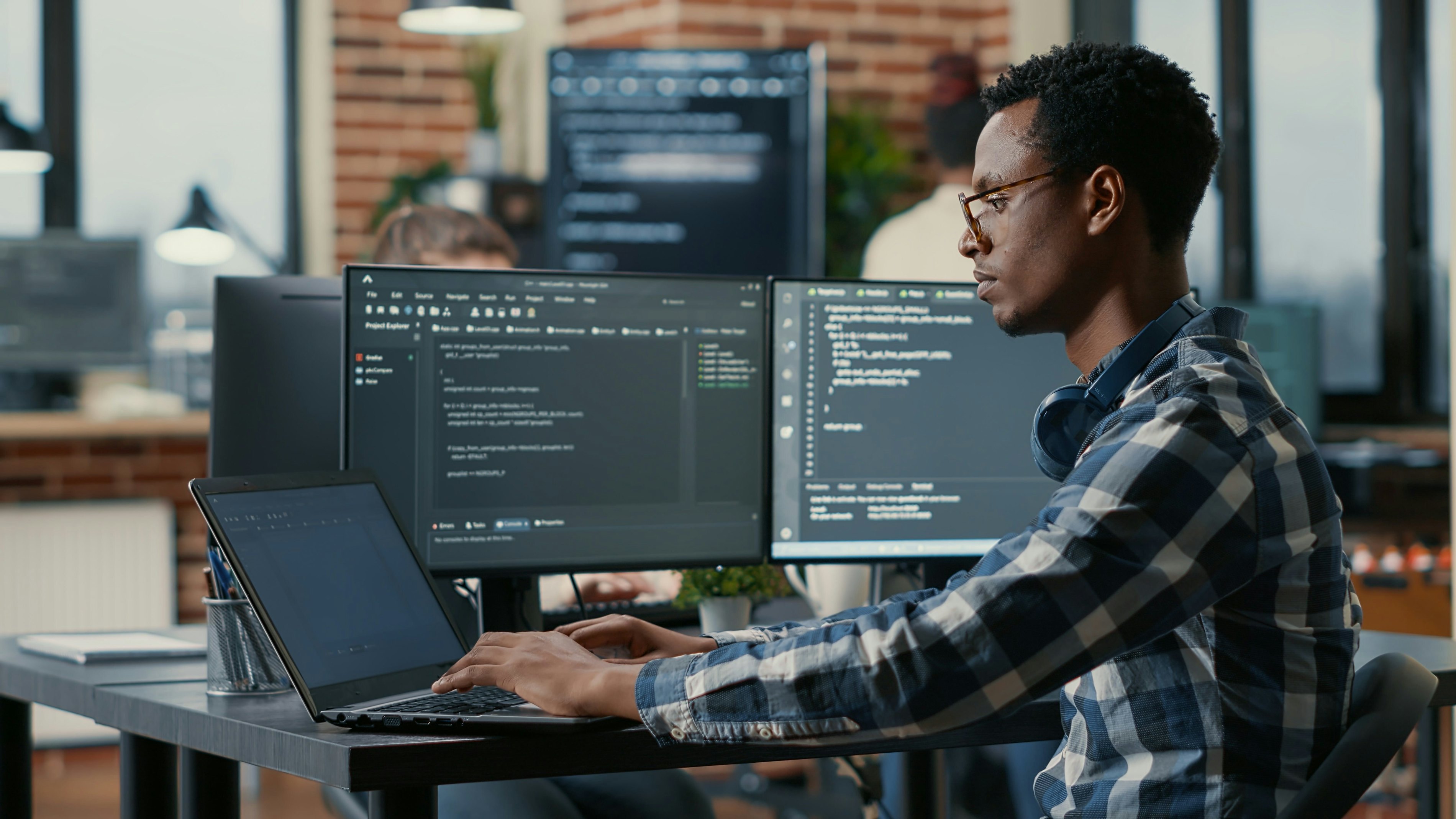 Man sitting behind laptop