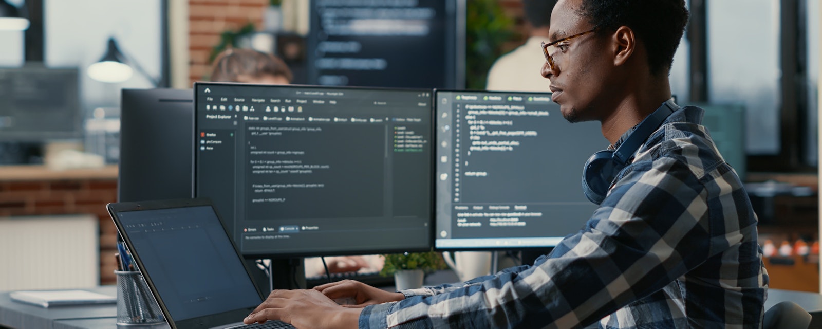 Man sitting behind laptop