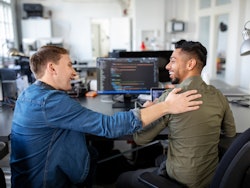 Cyber security engineers smiling