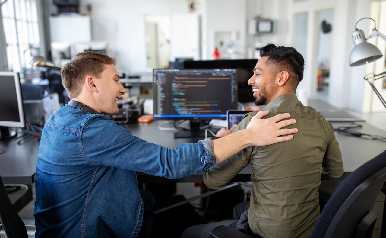 Cyber security engineers smiling