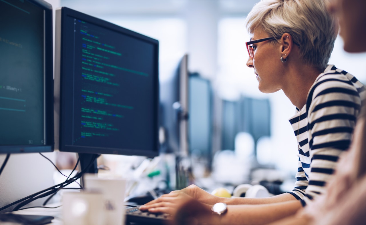 Cybersecurity engineer female desktop computer