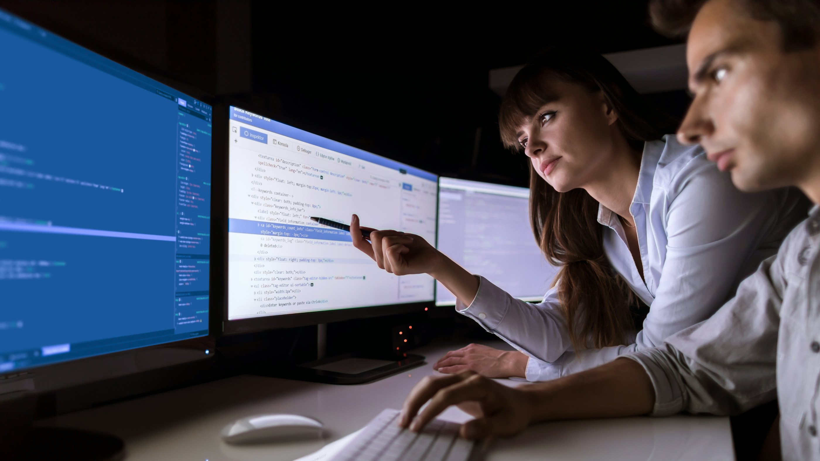 Cybersecurity engineers looking at latest cybersecurity challenges