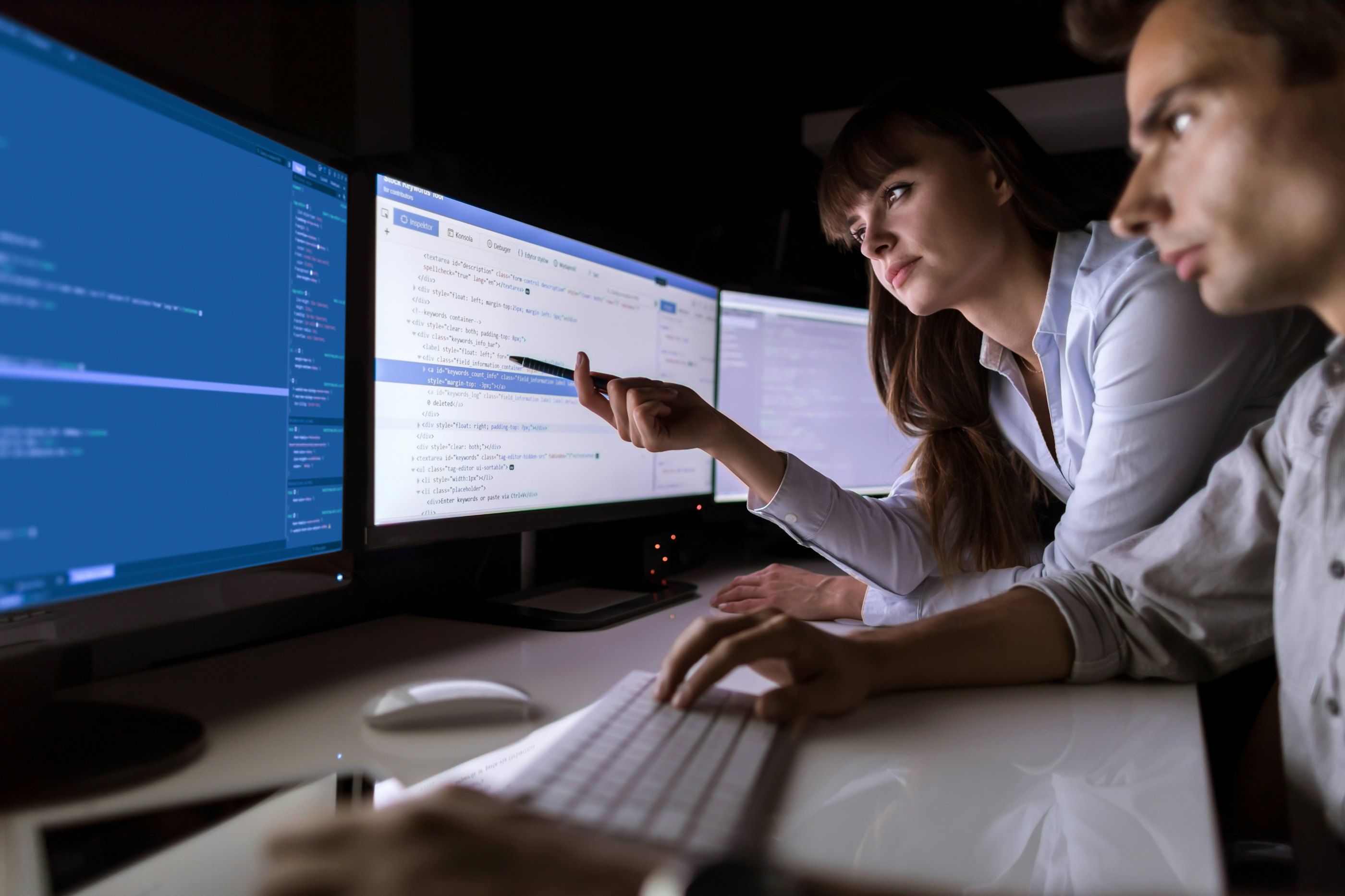 Cybersecurity engineers looking at latest cybersecurity challenges