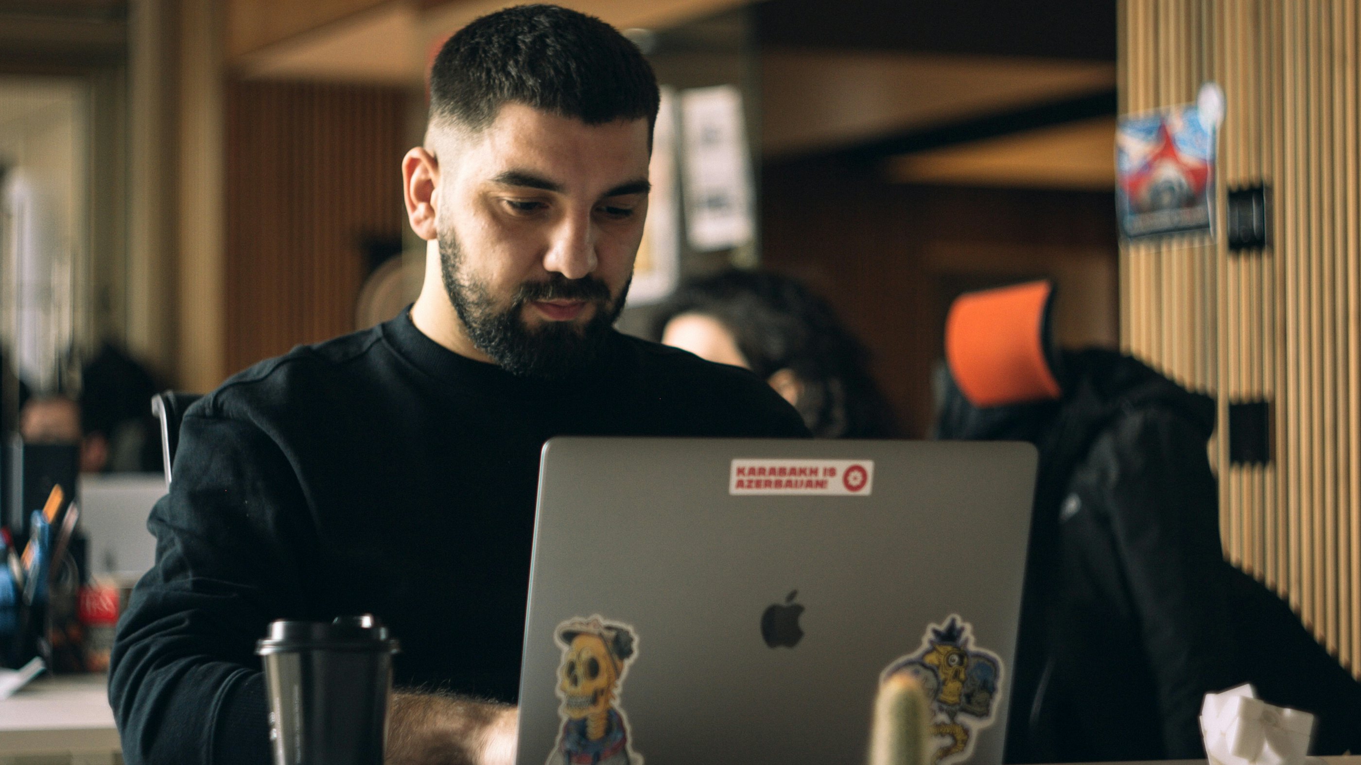 Engineer focused behind laptop