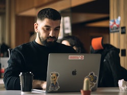 Engineer focused behind laptop