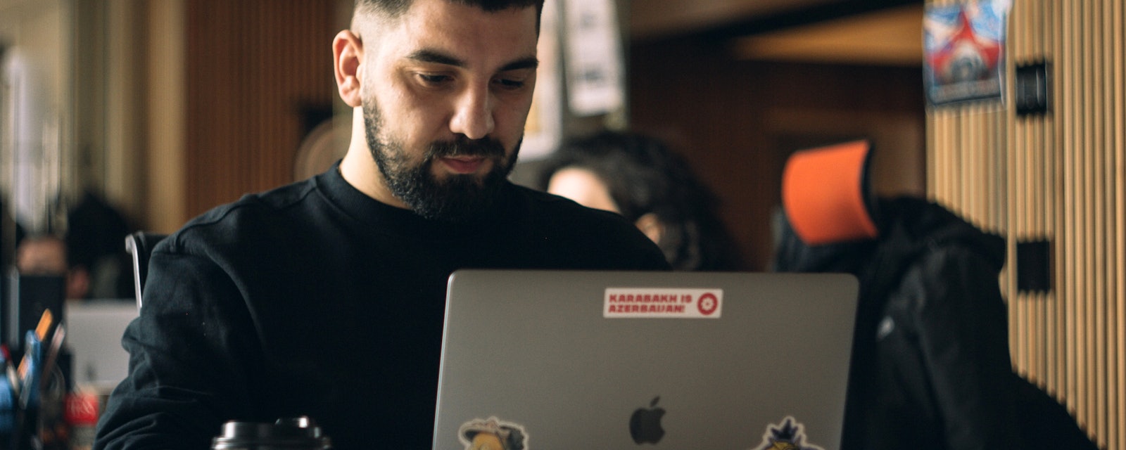 Engineer focused behind laptop