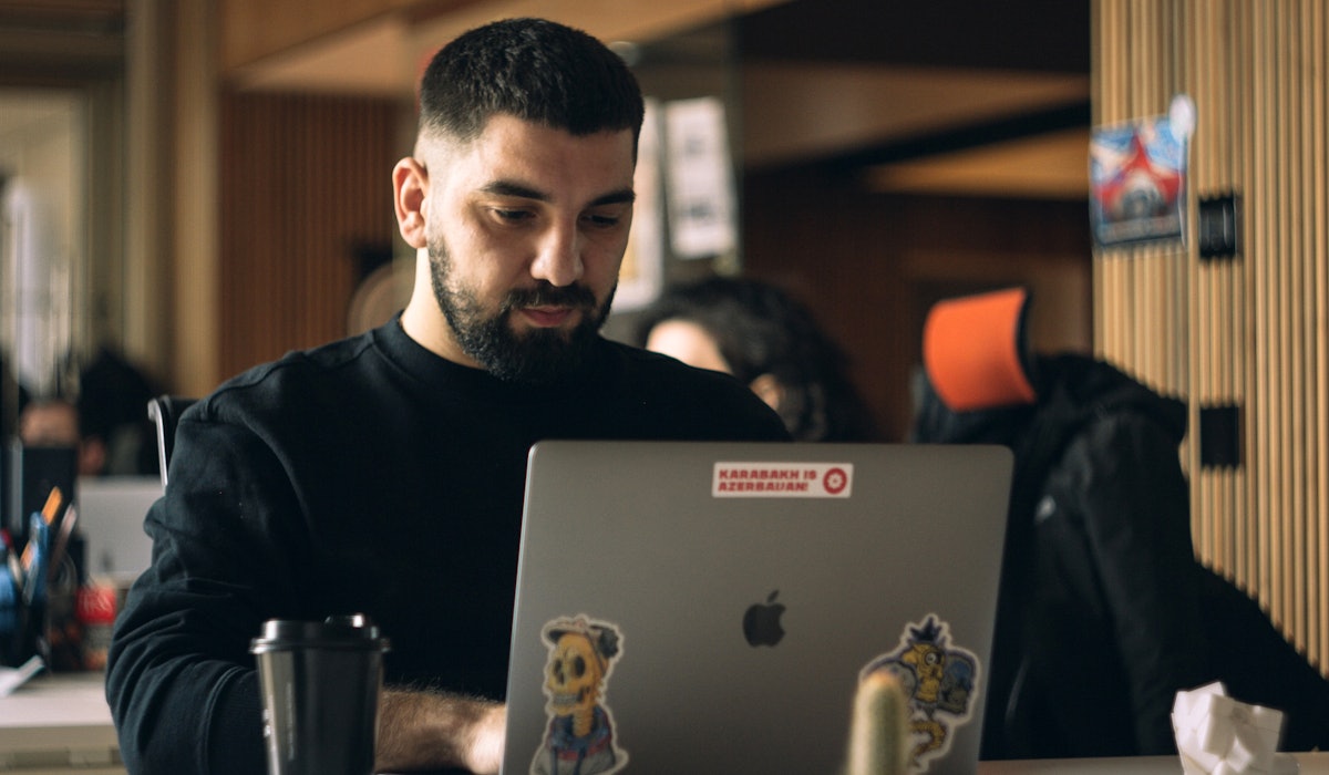 Engineer focused behind laptop