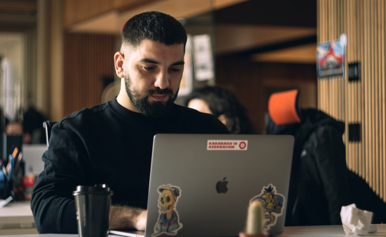 Engineer focused behind laptop