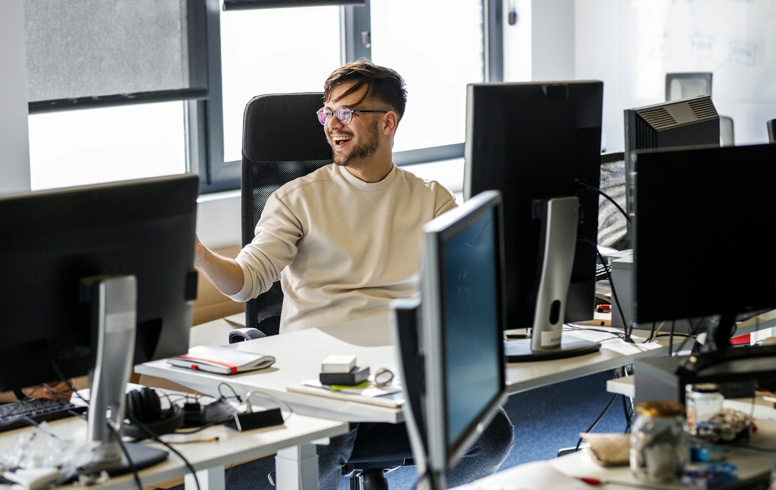 Engineer laughing behind desk