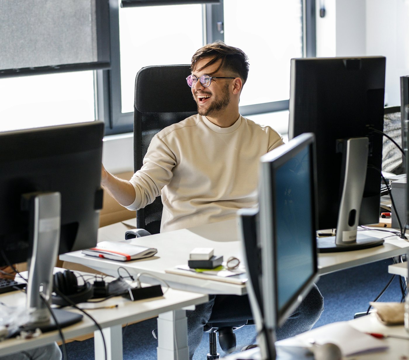 Engineer laughing behind desk