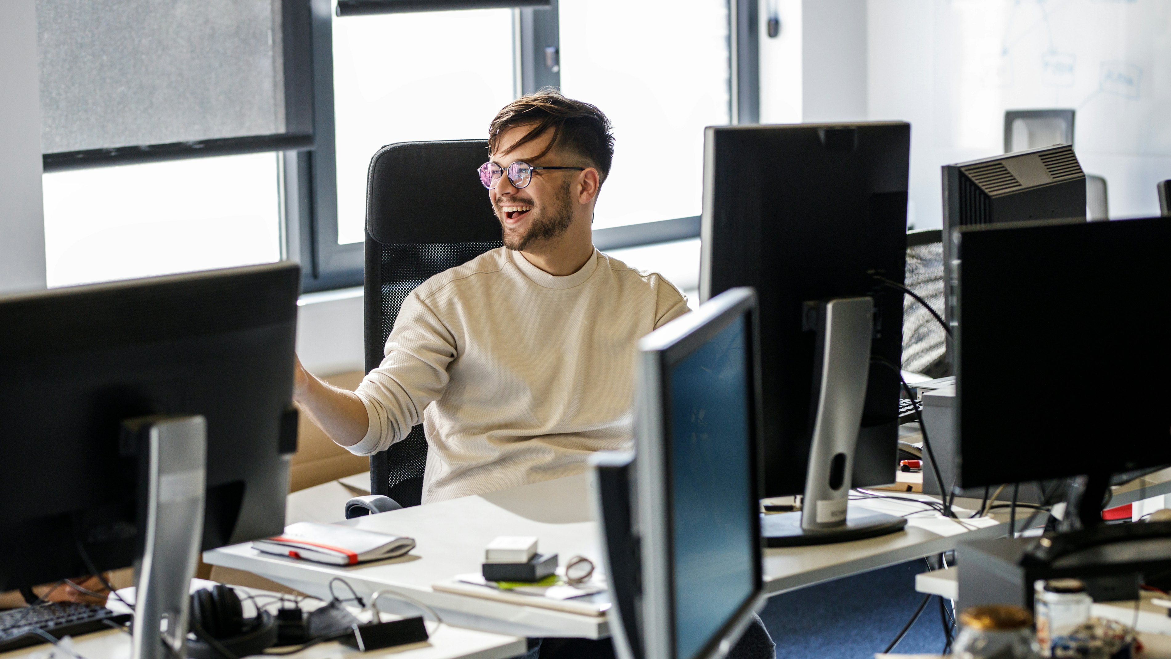 Engineer laughing behind desk