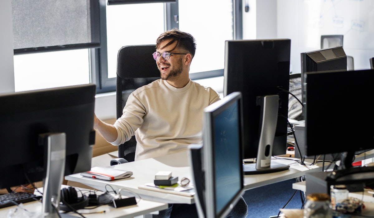 Engineer laughing behind desk