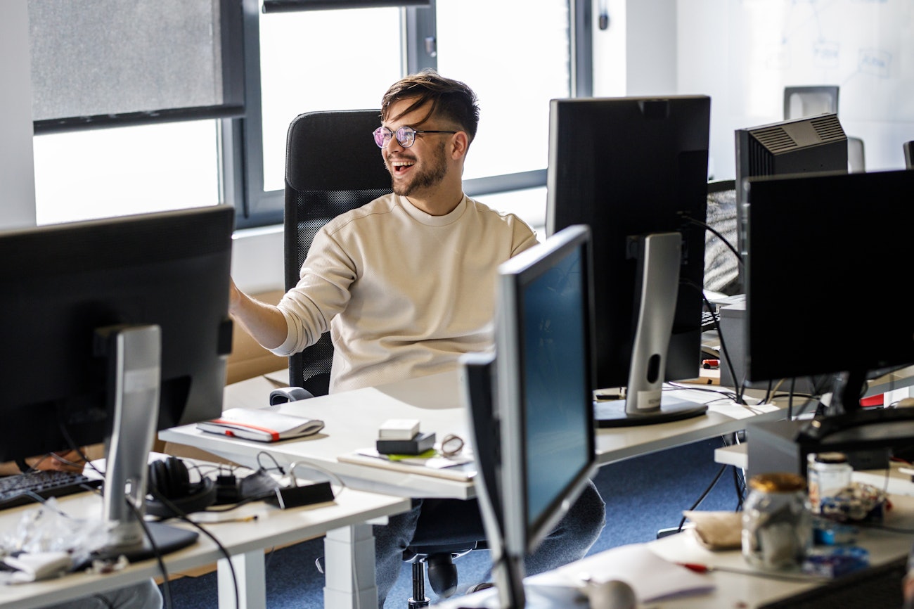 Engineer laughing behind desk