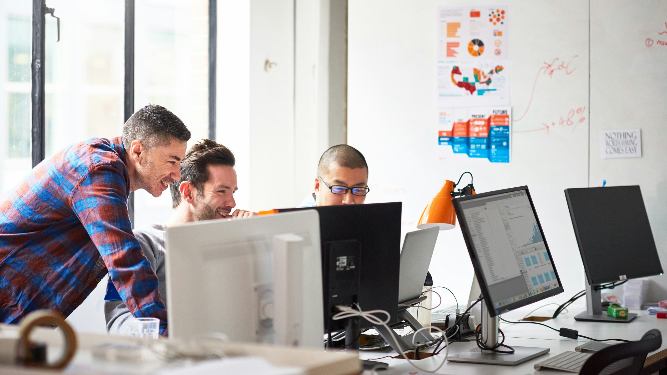 Engineers in office laughing