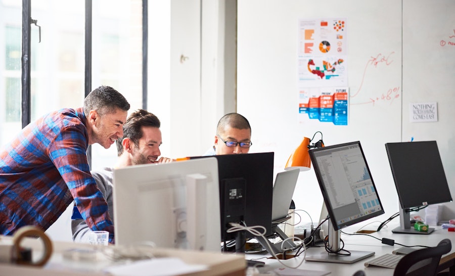 Engineers in office laughing