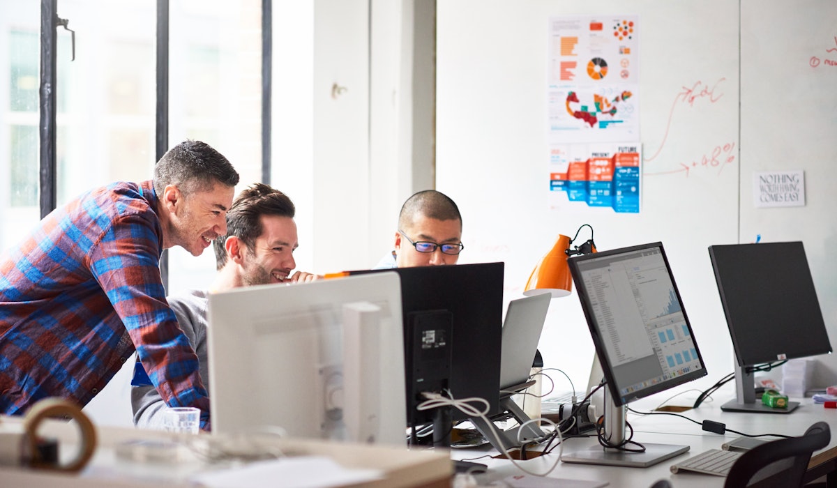 Engineers in office laughing