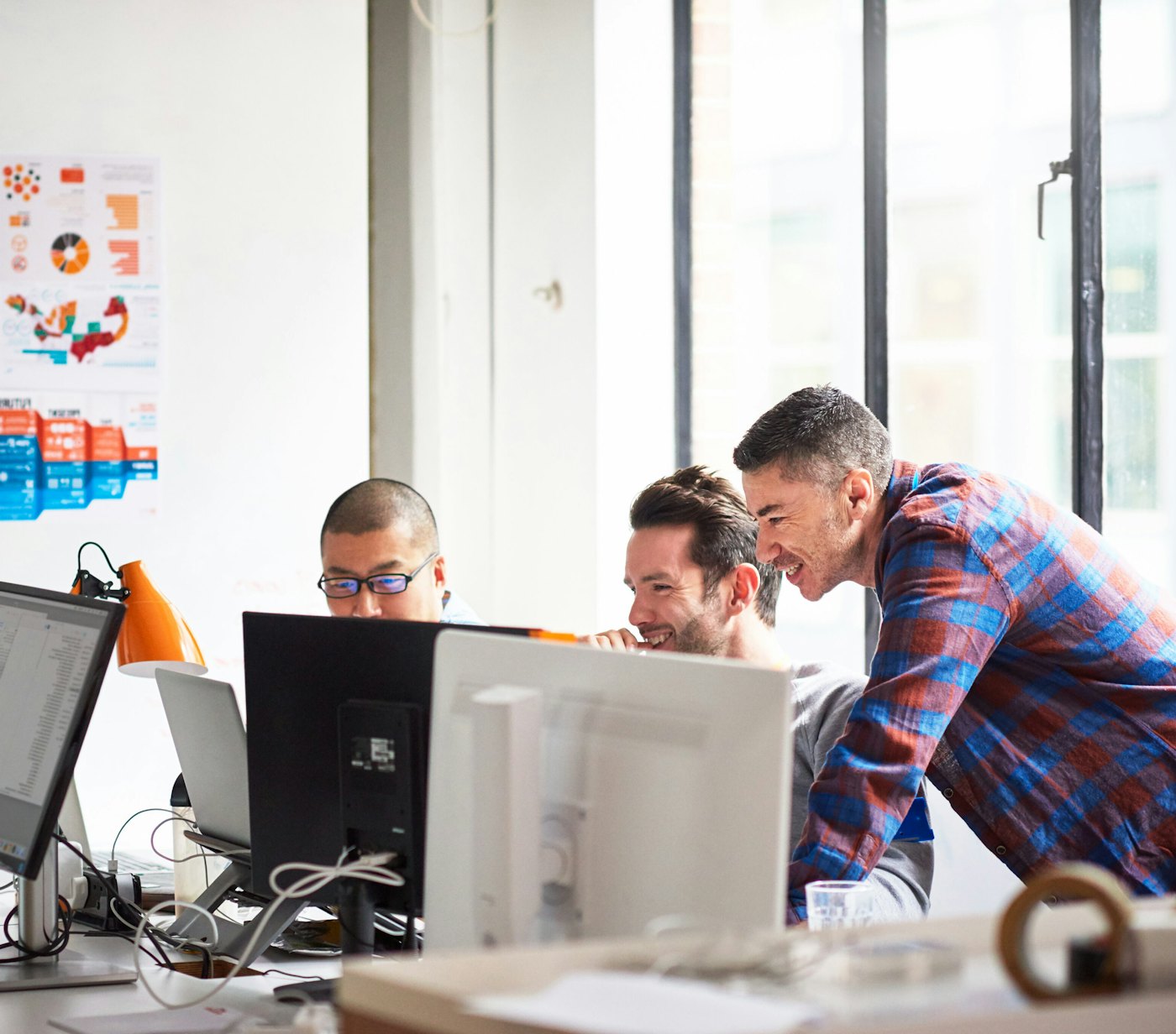 Engineers in office laughing