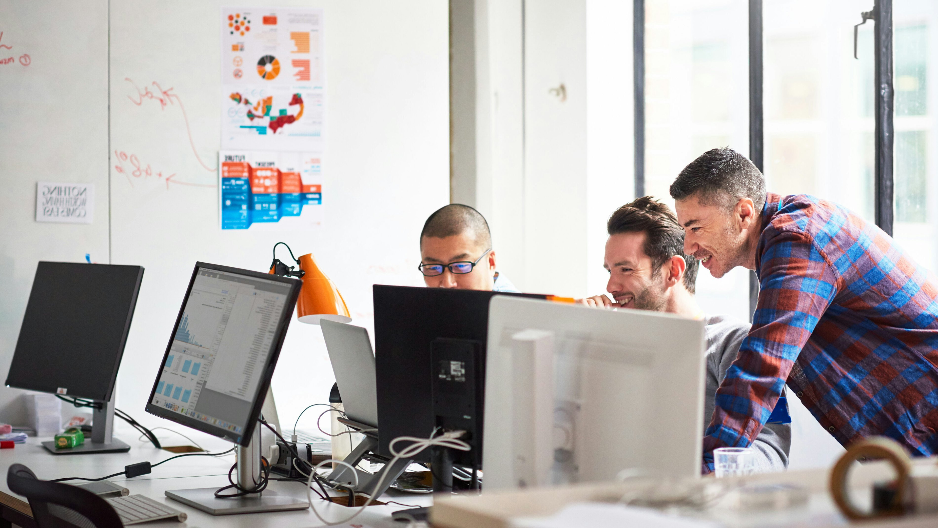 Engineers in office laughing