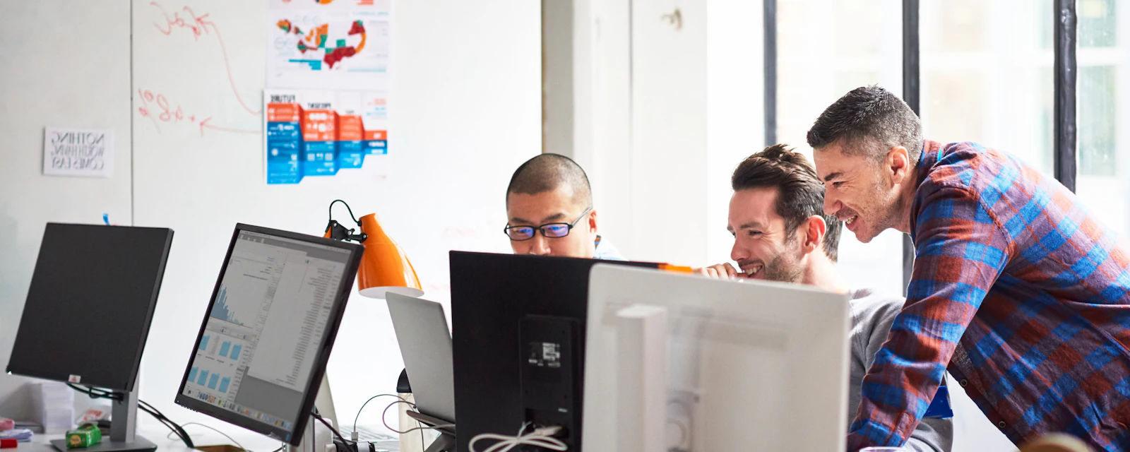 Engineers in office laughing