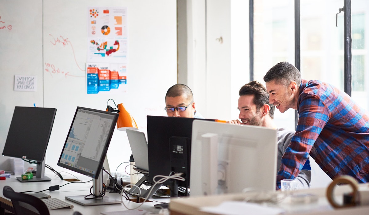 Engineers in office laughing