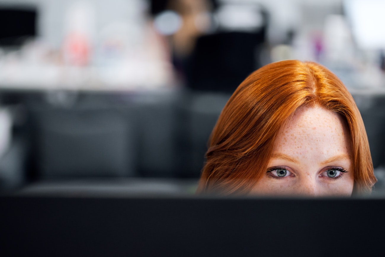 Female engineer behind screen