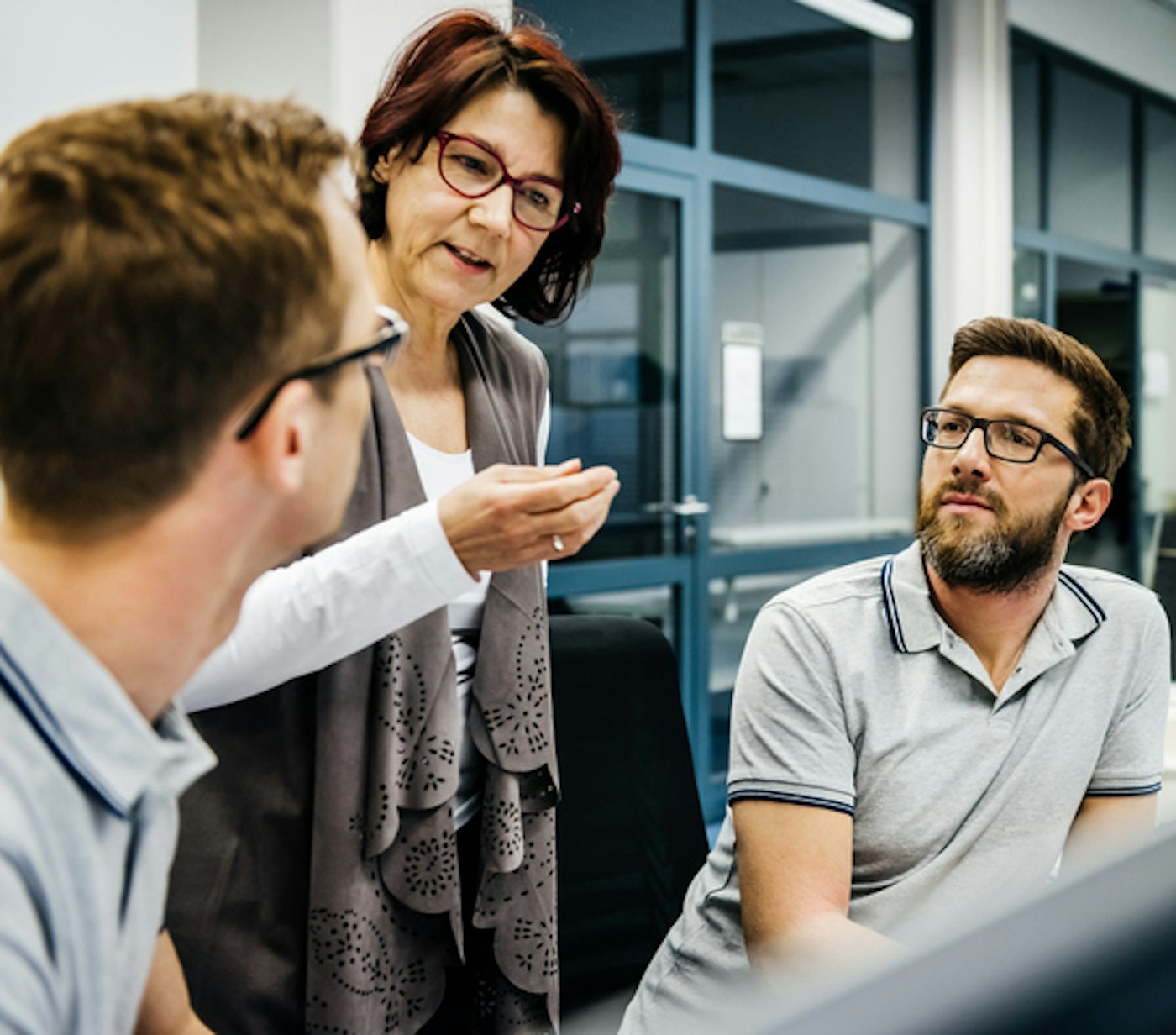 Senior female manager with two engineers