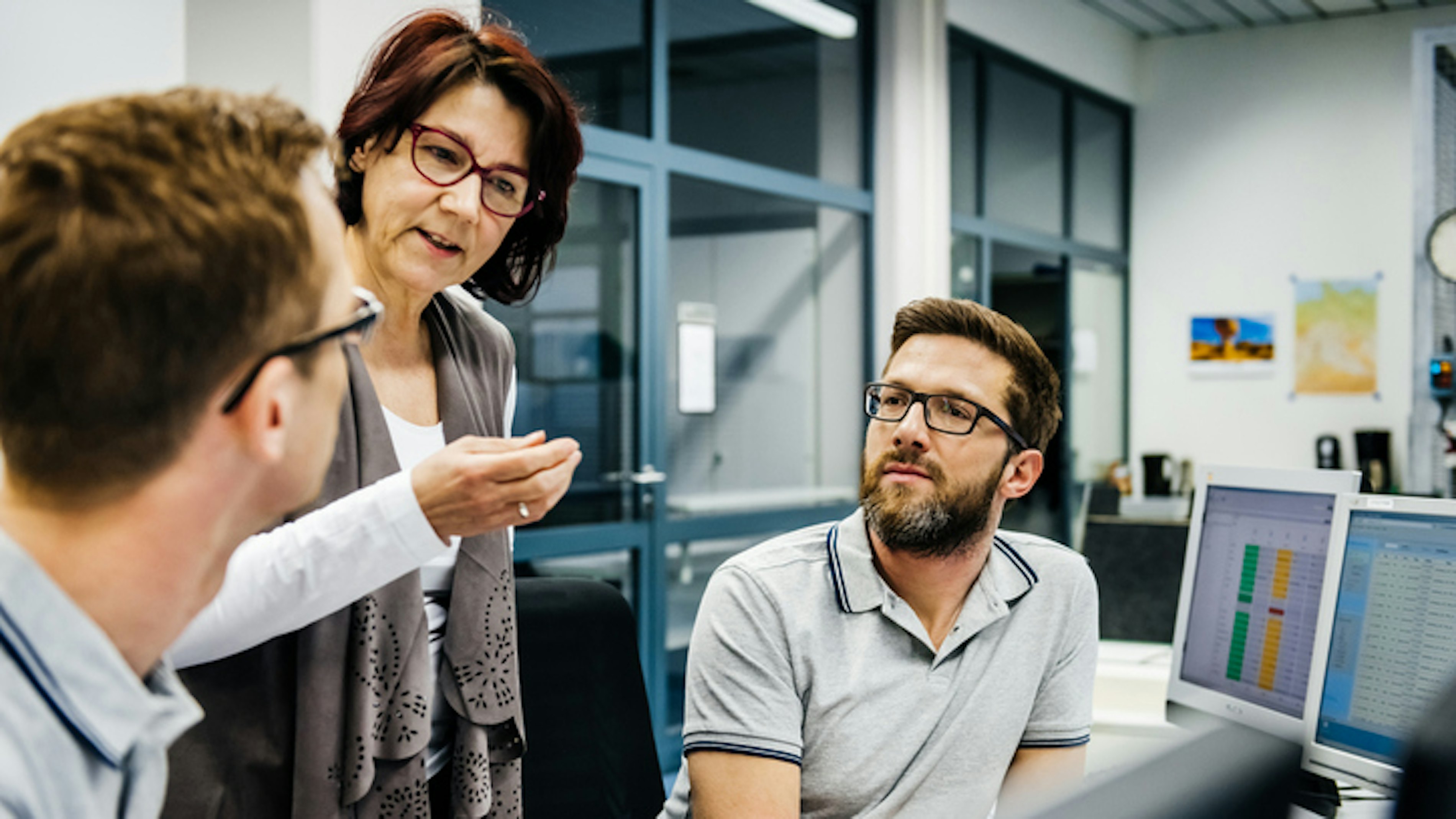 Senior female manager with two engineers