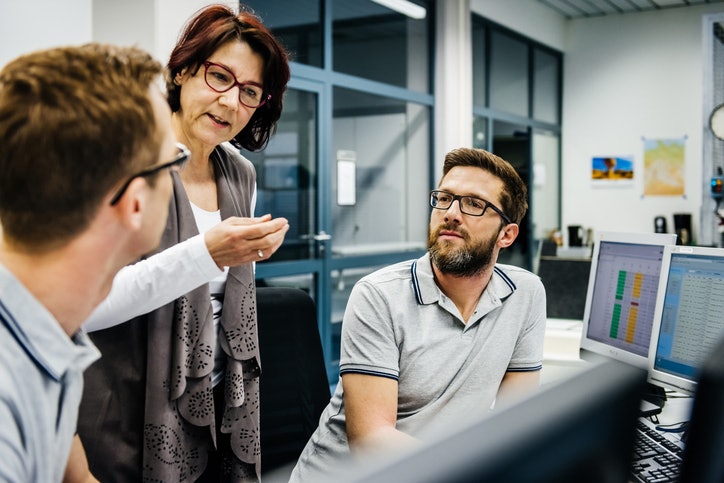Senior female manager with two engineers