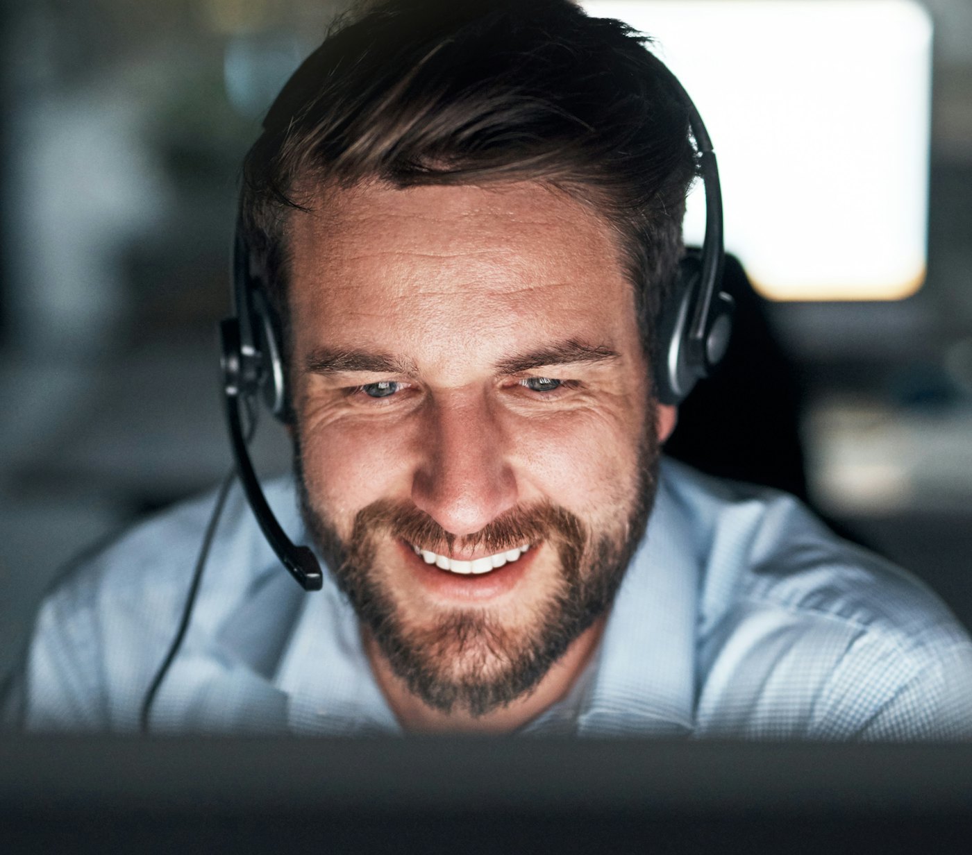 Support engineer with headset smiling