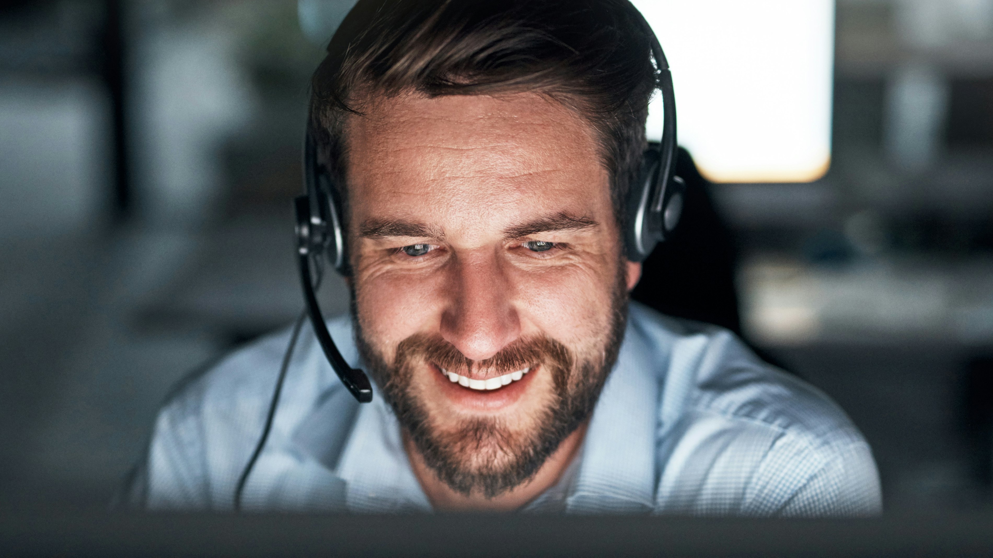 Support engineer with headset smiling