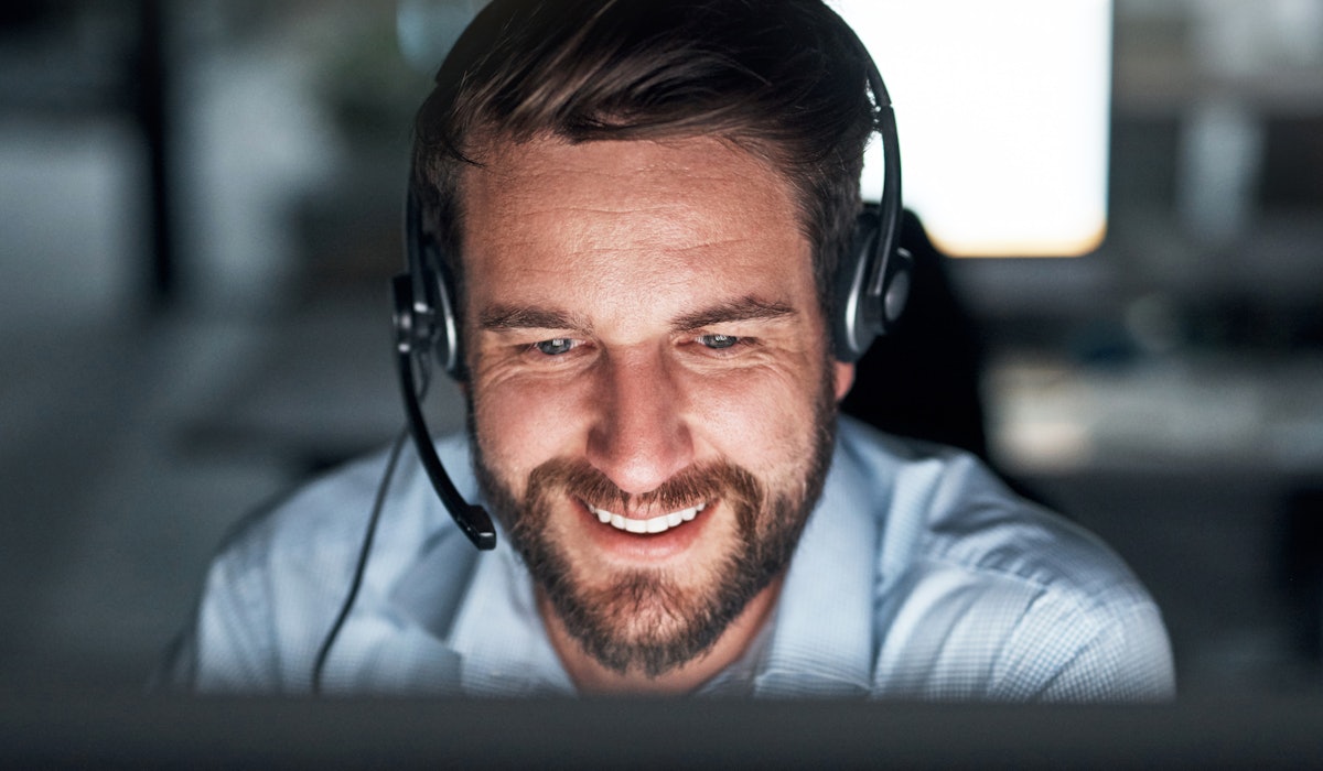 Support engineer with headset smiling