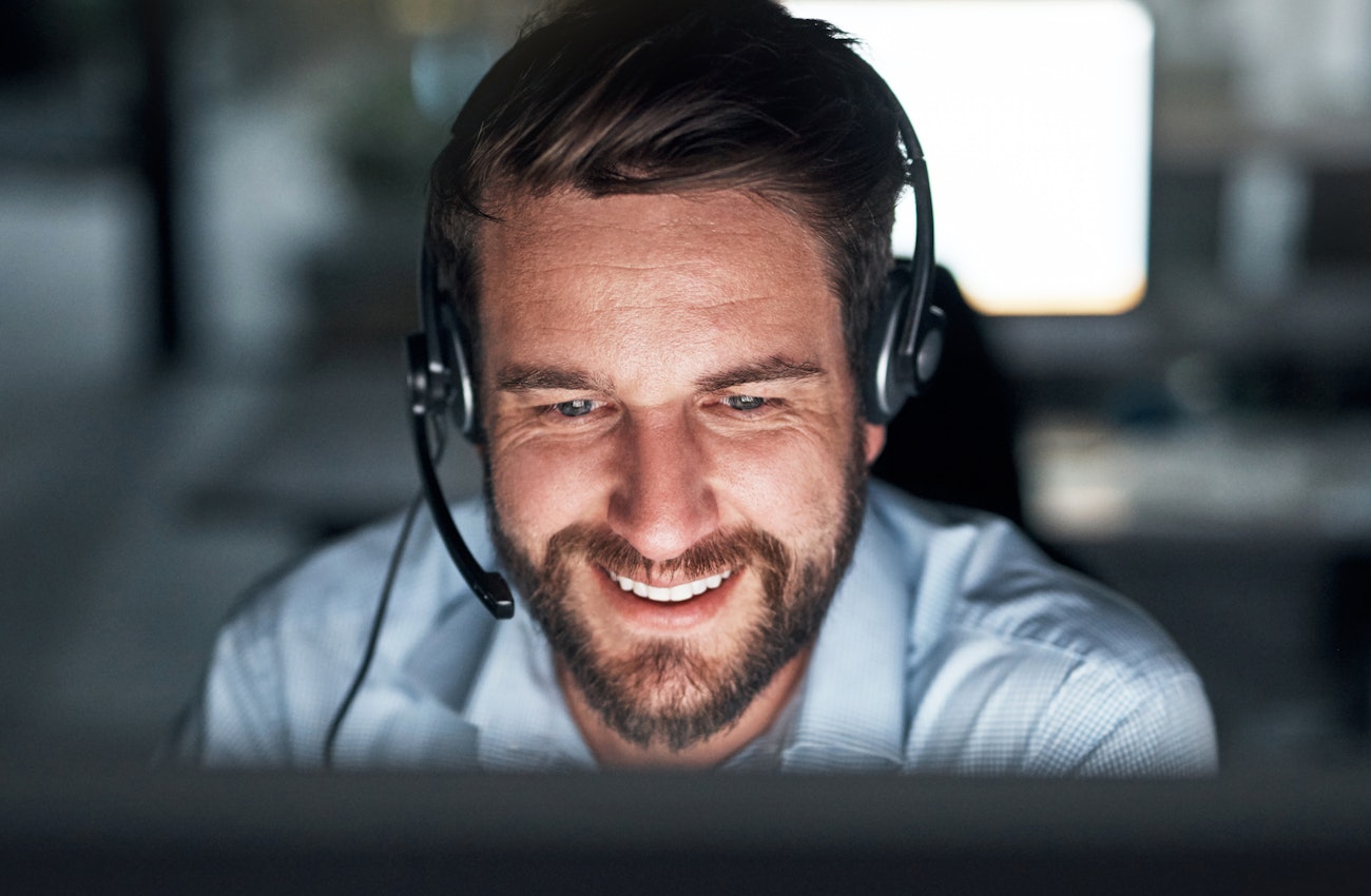 Support engineer with headset smiling