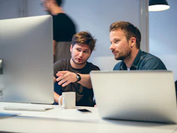 Engineers working on risk exposure management