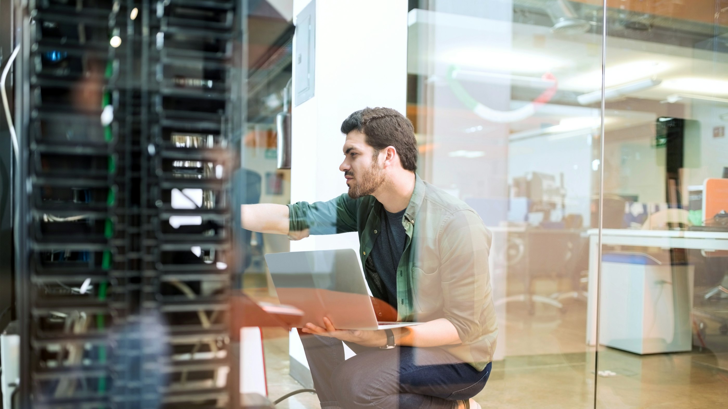 Young engineer datacenter room