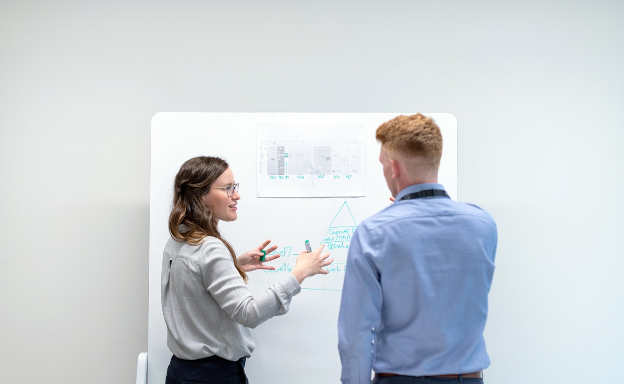 Young engineers whiteboard design