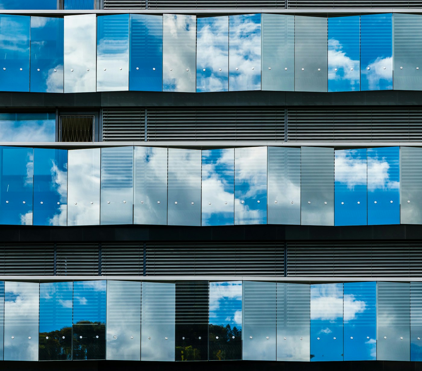 Office facade cloud reflection