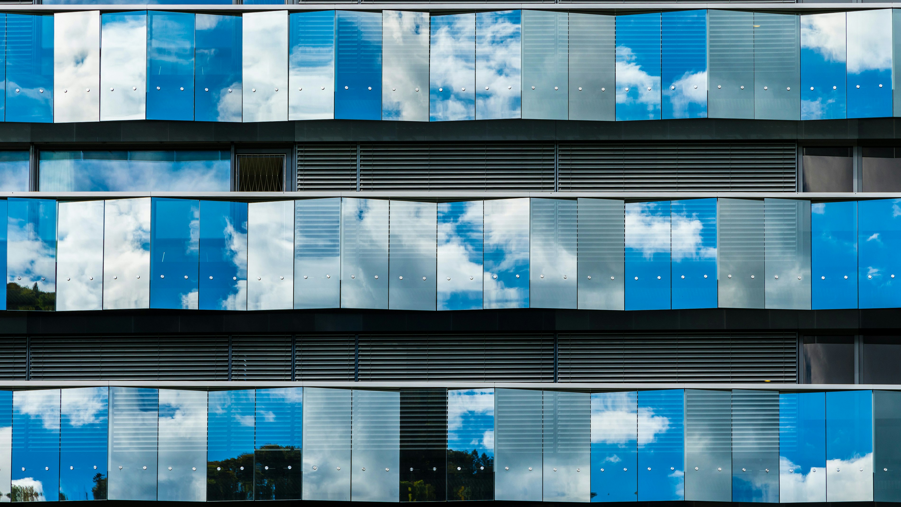 Office facade cloud reflection