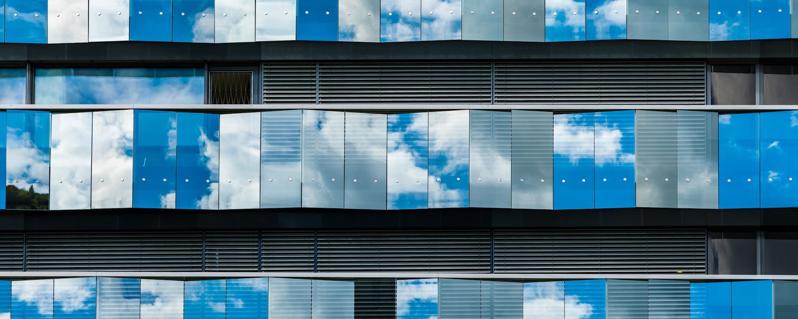 Office facade cloud reflection
