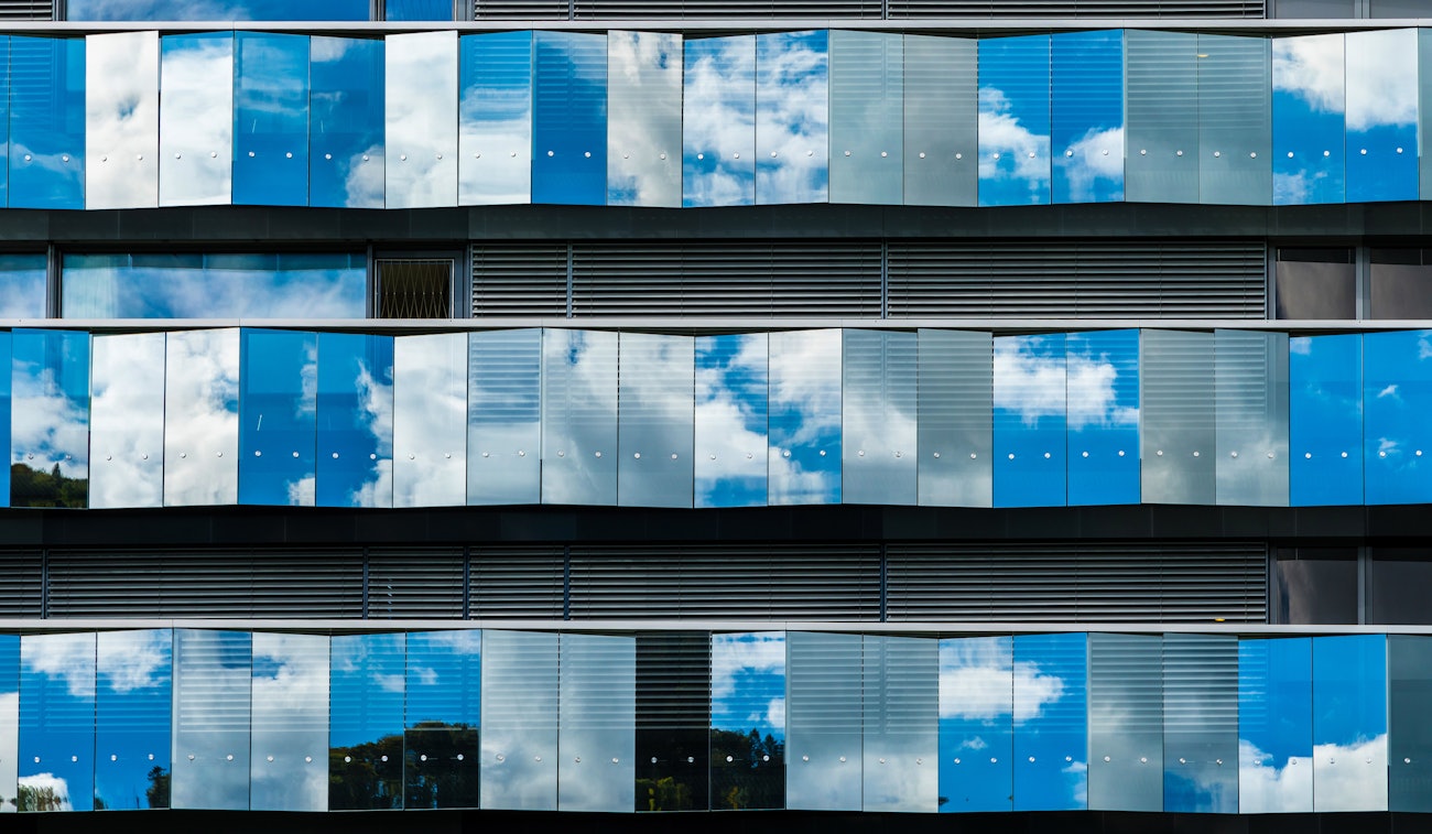 Office facade cloud reflection