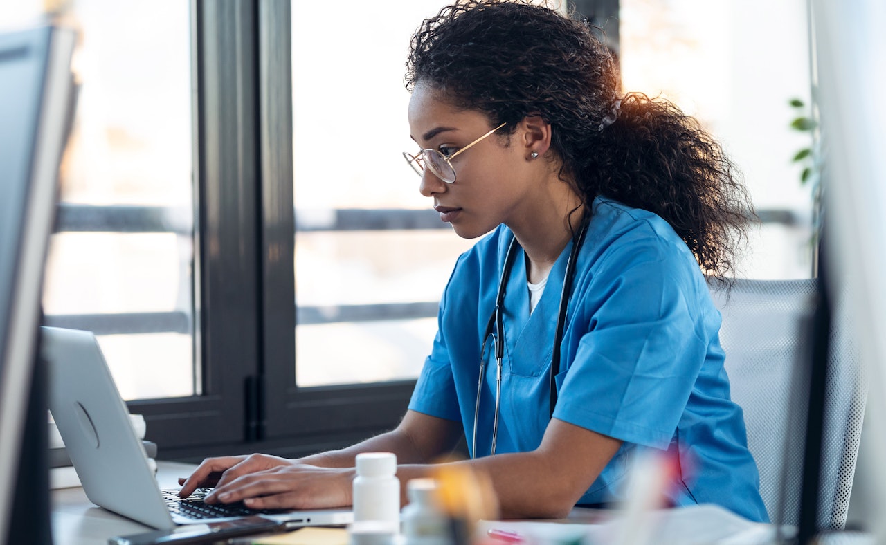 Nurse behind laptop healthcare