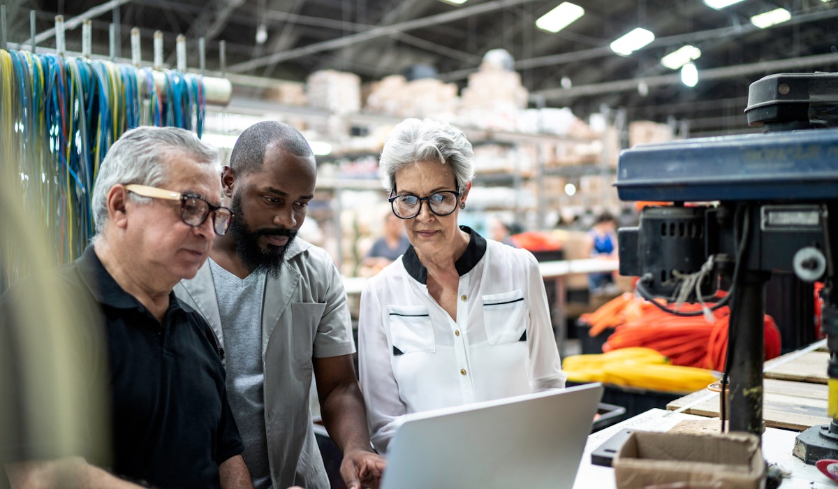 Manufacturing employees factory laptop