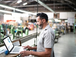 Manufacturing factory worker laptop