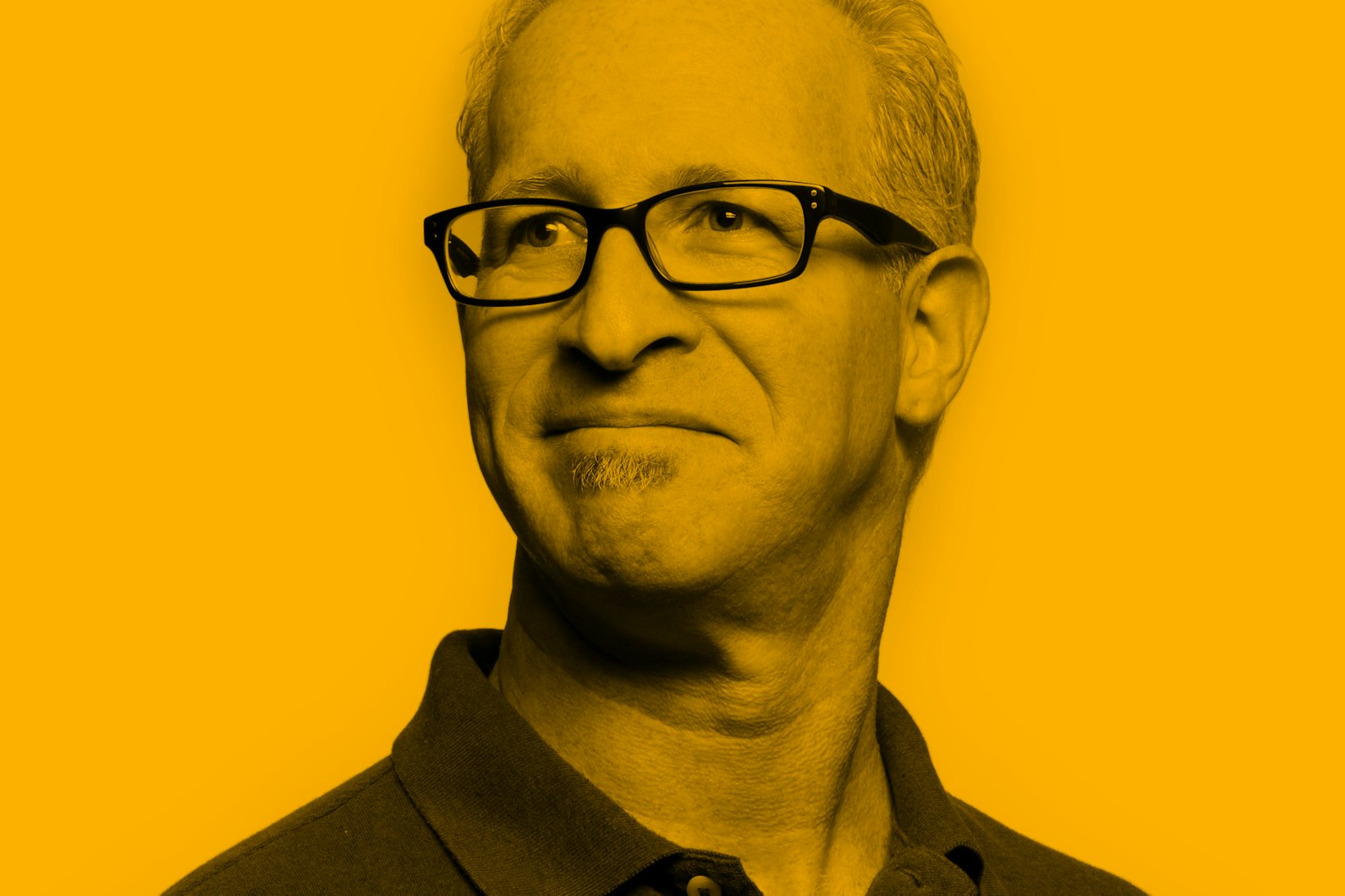 Portrait of male grey hear wearing polo