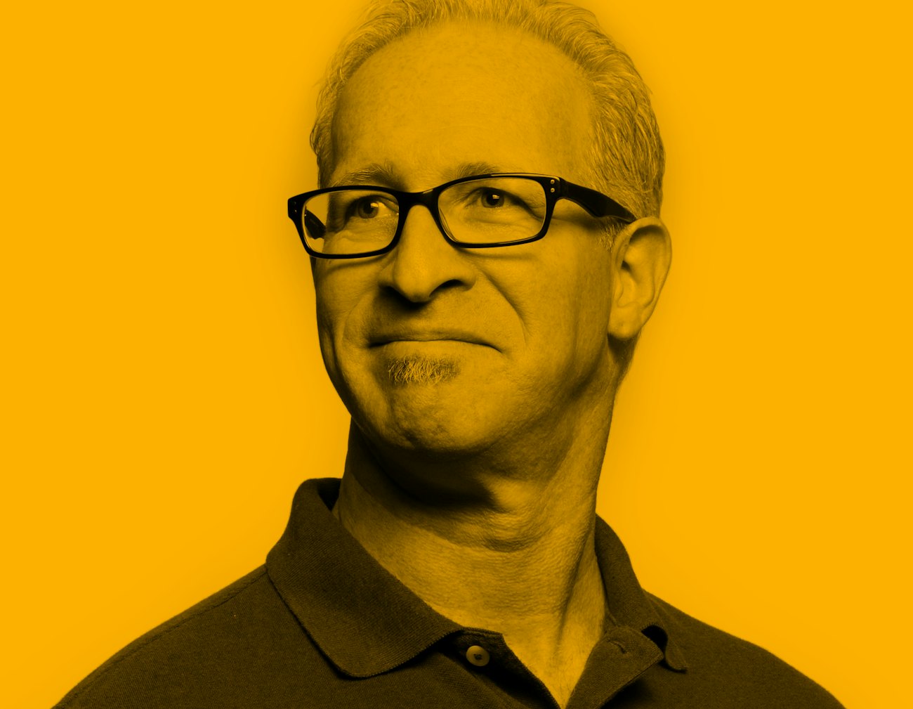 Portrait of male grey hear wearing polo