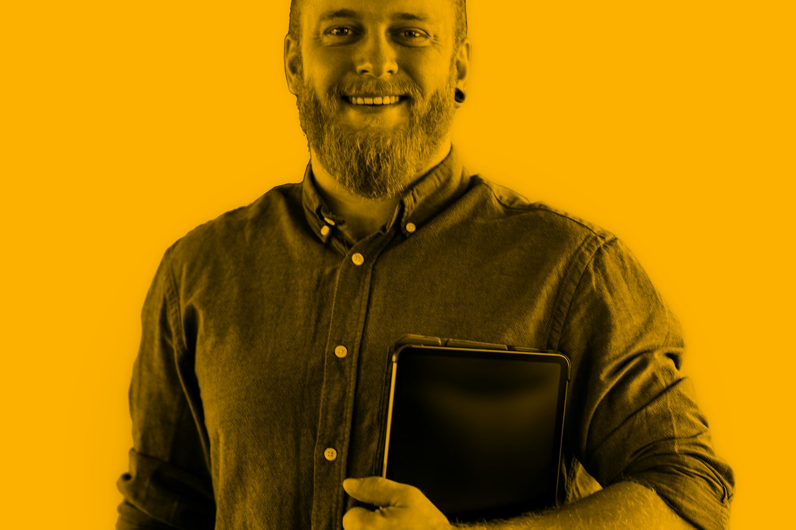 Portrait of man holding tablet