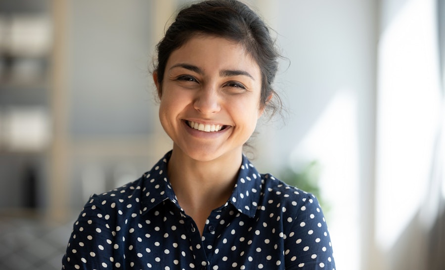 Portrait of young ethnic woman smiling