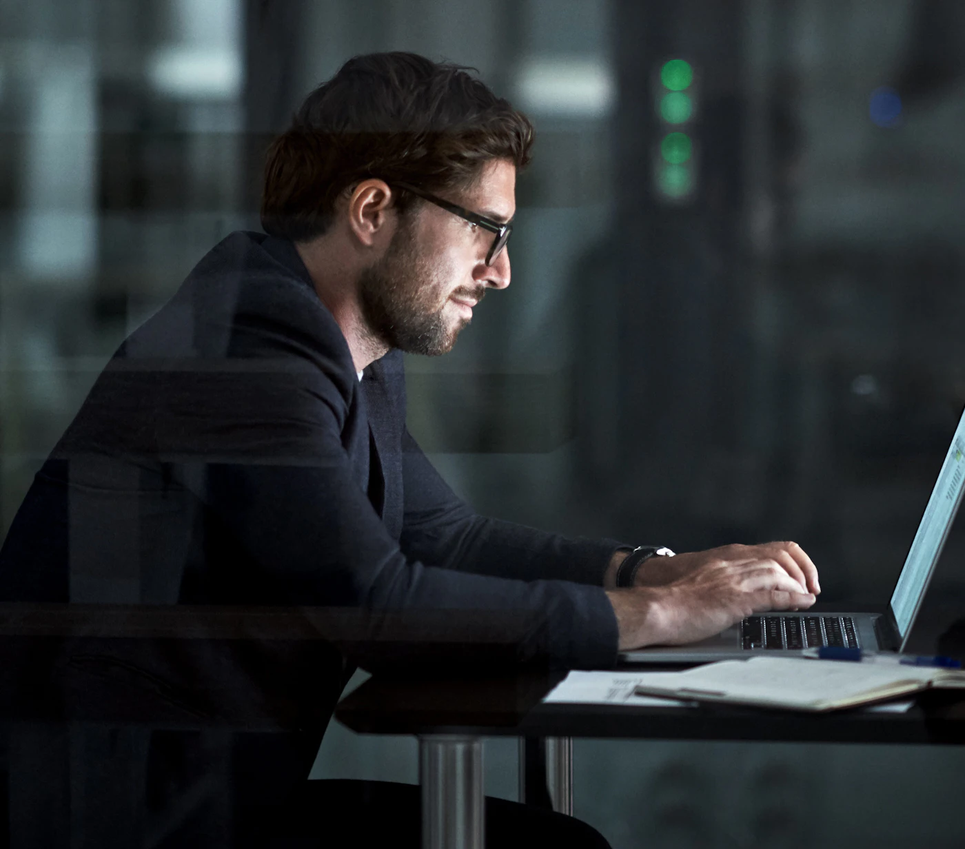 Man sitting behind laptop quantum computing threat