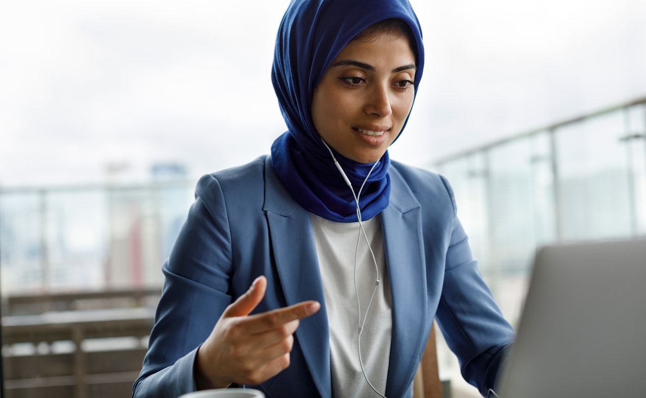 Woman headphones on call laptop